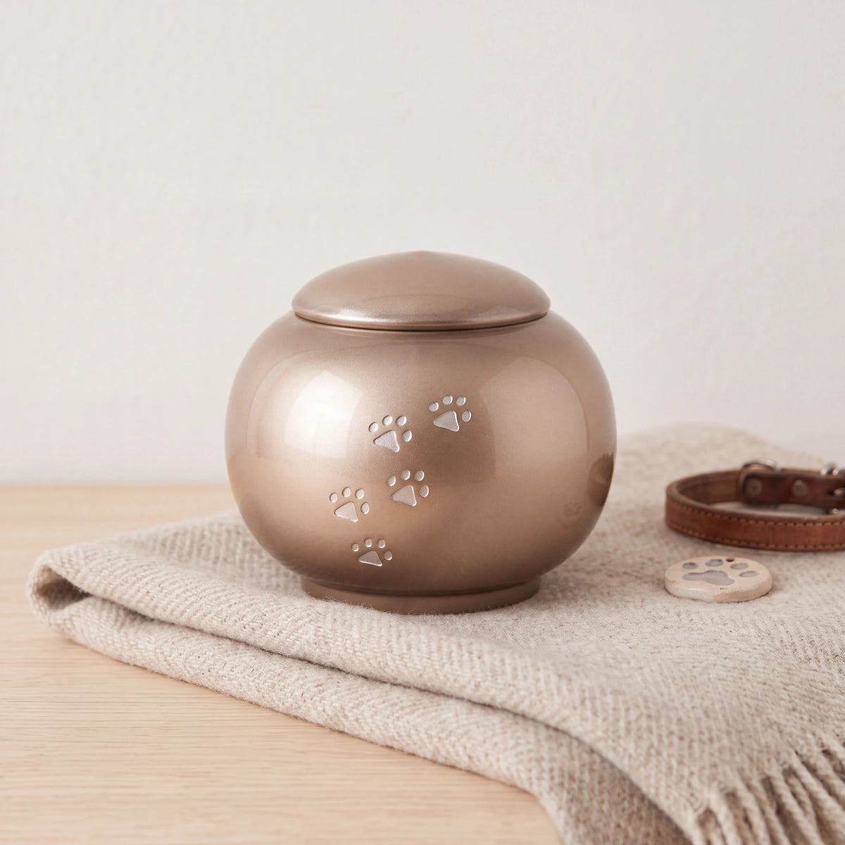 Pawprints-Round-Crystal-Pet-Urn-for-Ashes-in-Cappuccino-Small-pet_blanket_fold