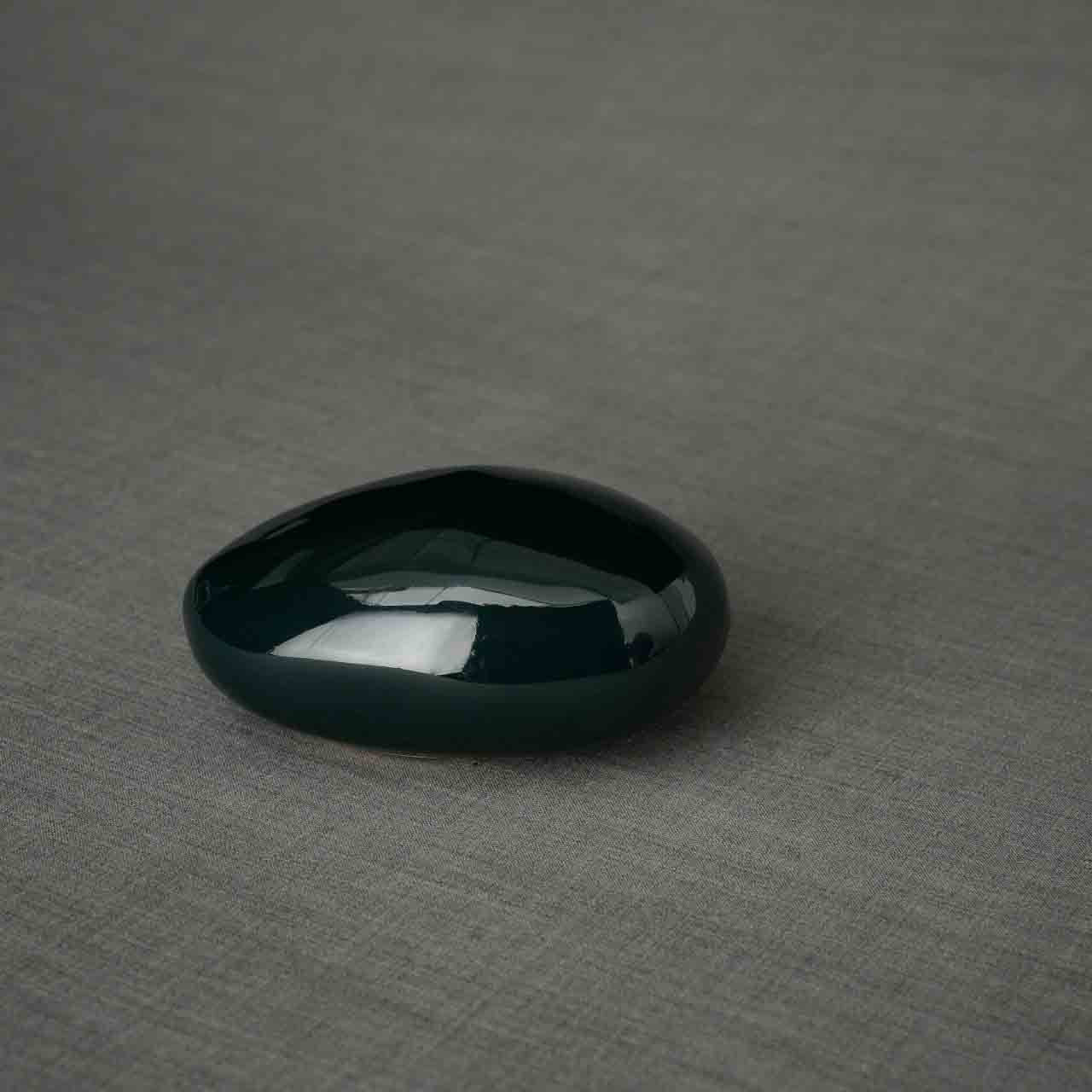 Pebbles Ashes Keepsake Urn in Dark Green Dark Background