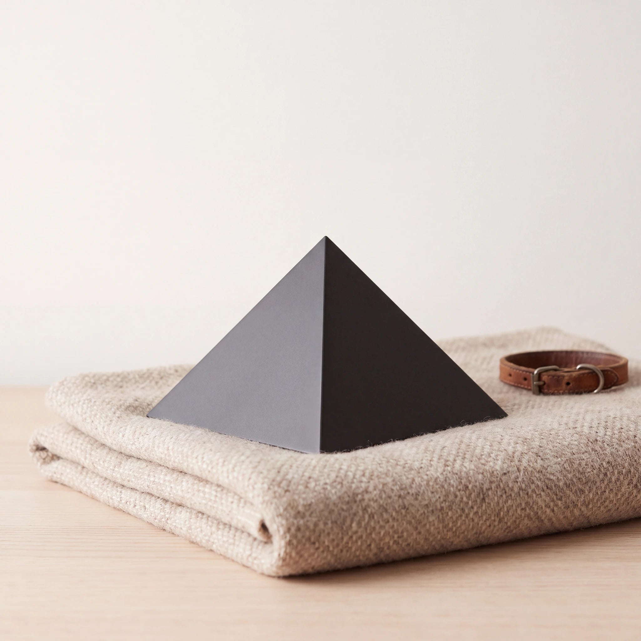 Pyramid-Pet-Urn-for-Ashes-in-Matte-Black-Stainless-Steel-pet_blanket_fold