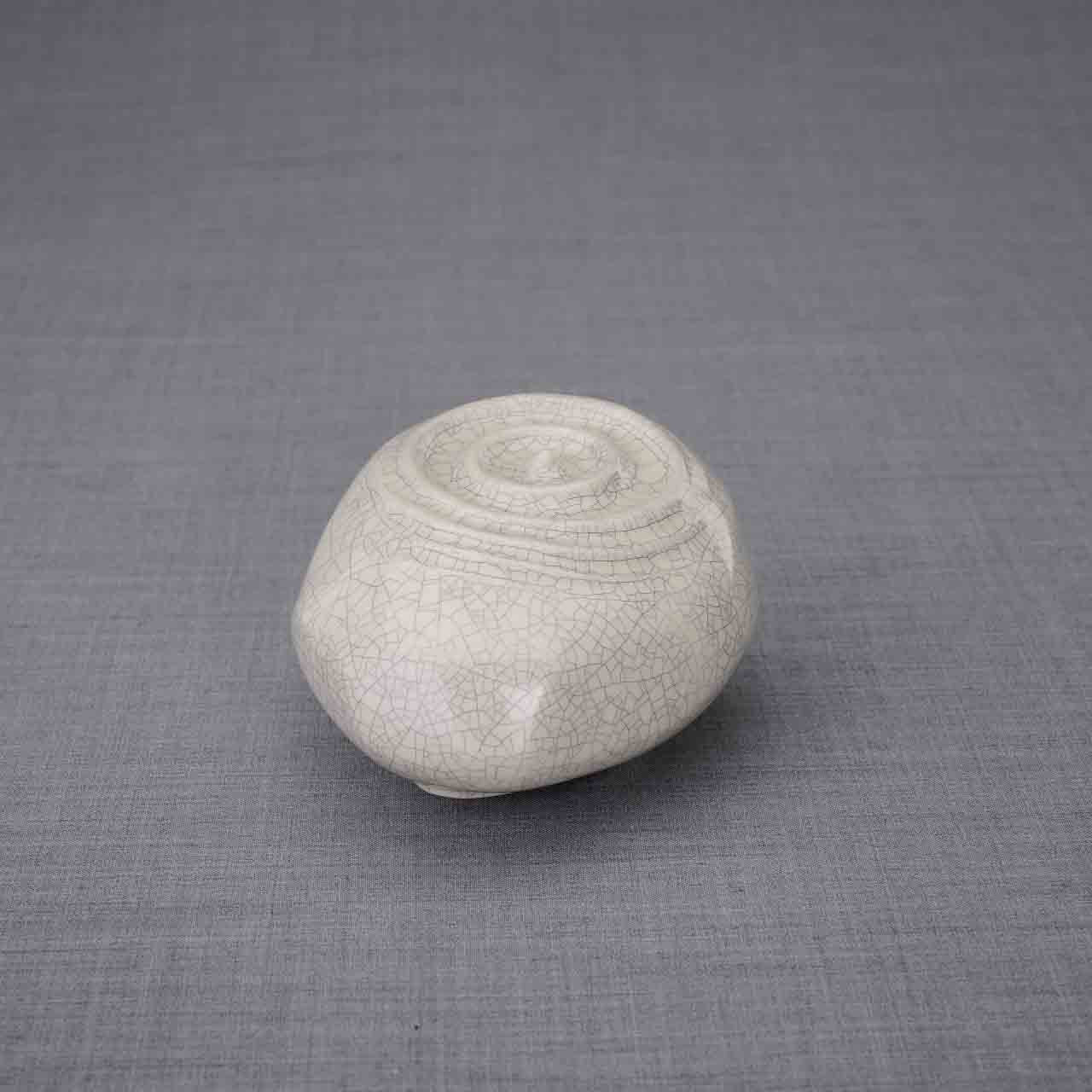 Resonance Ashes Keepsake Urn in Crackle Glaze Facing Left Dark Background