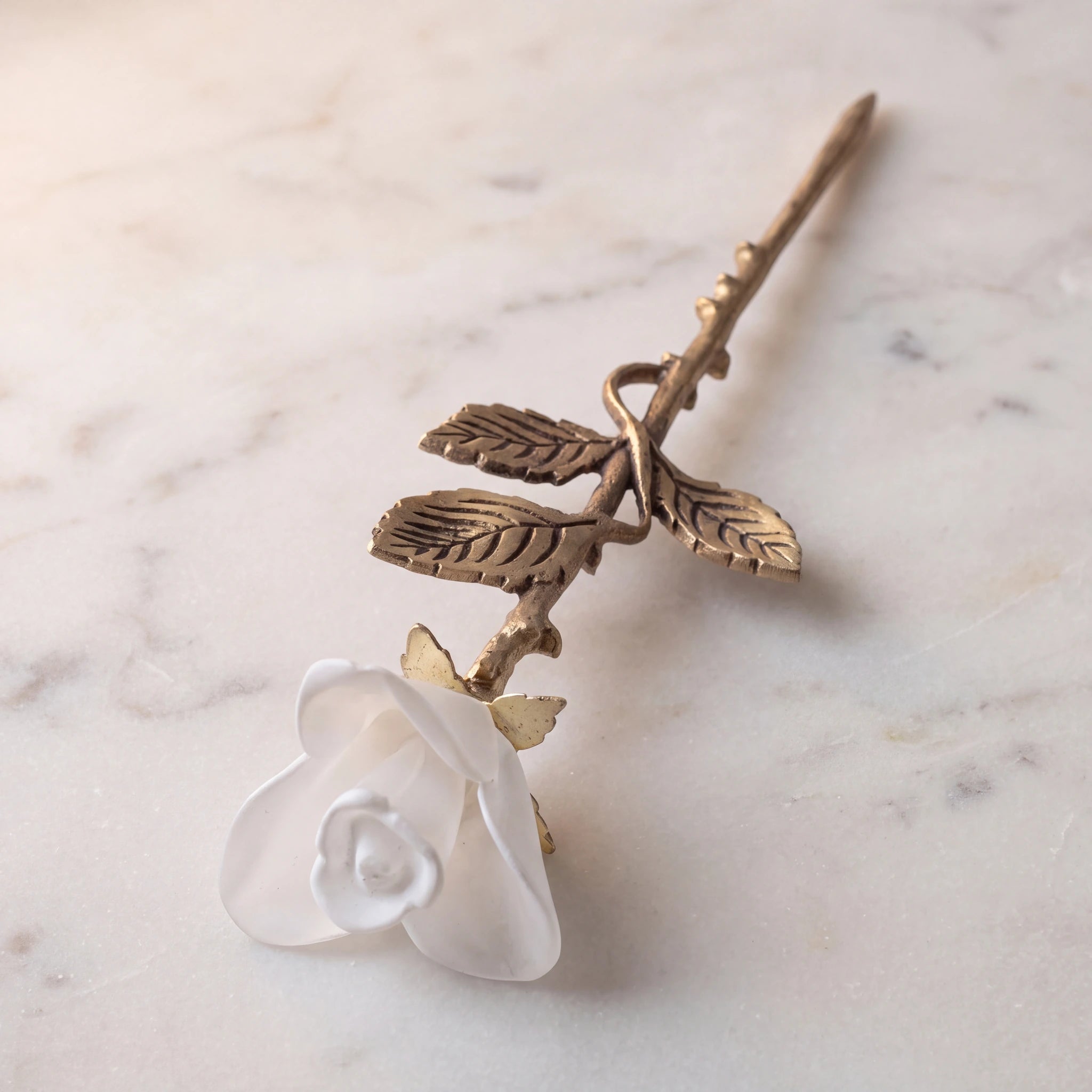Rose-Keepsake-Urn-for-Ashes-in-White-and-Bronze-On-Marble