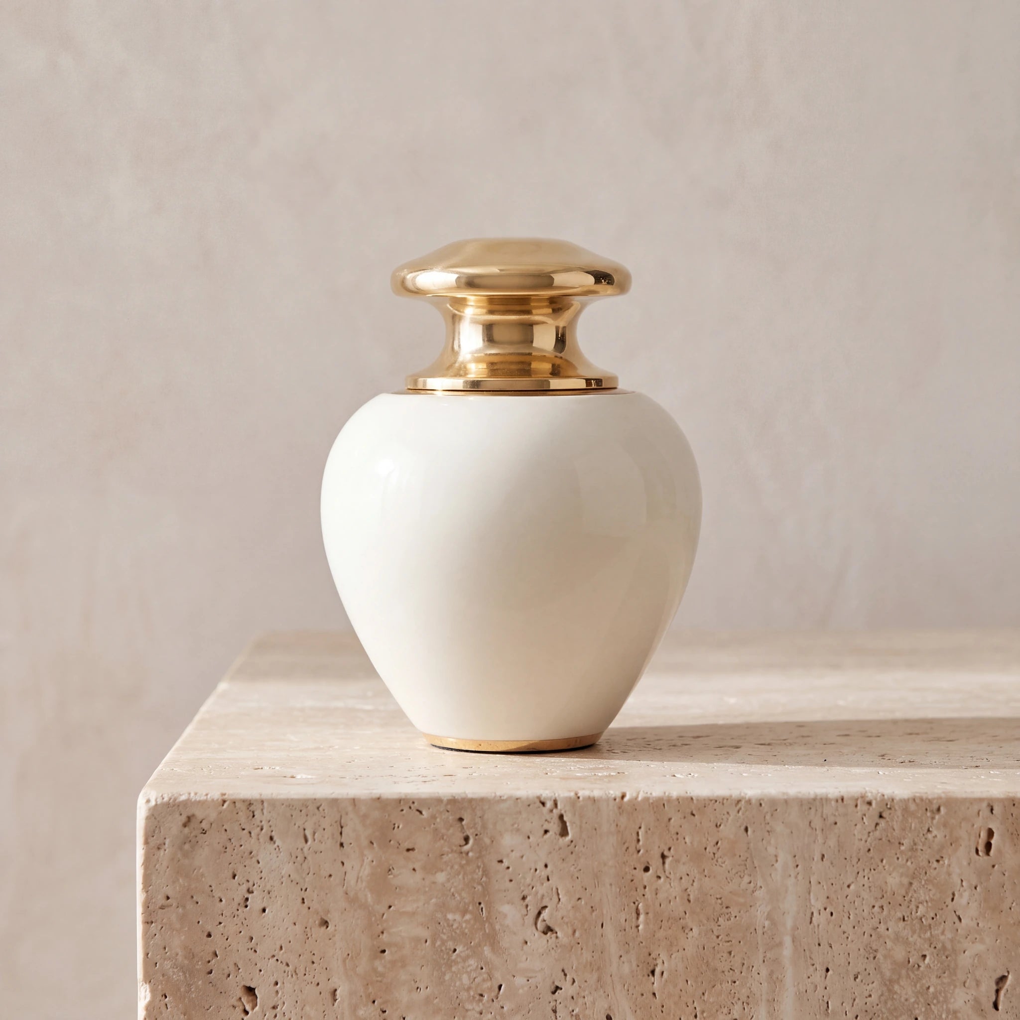 Satori-Metal-Keepsake-Urn-for-Ashes-in-Ivory-and-Gold-Travertine-Ledge