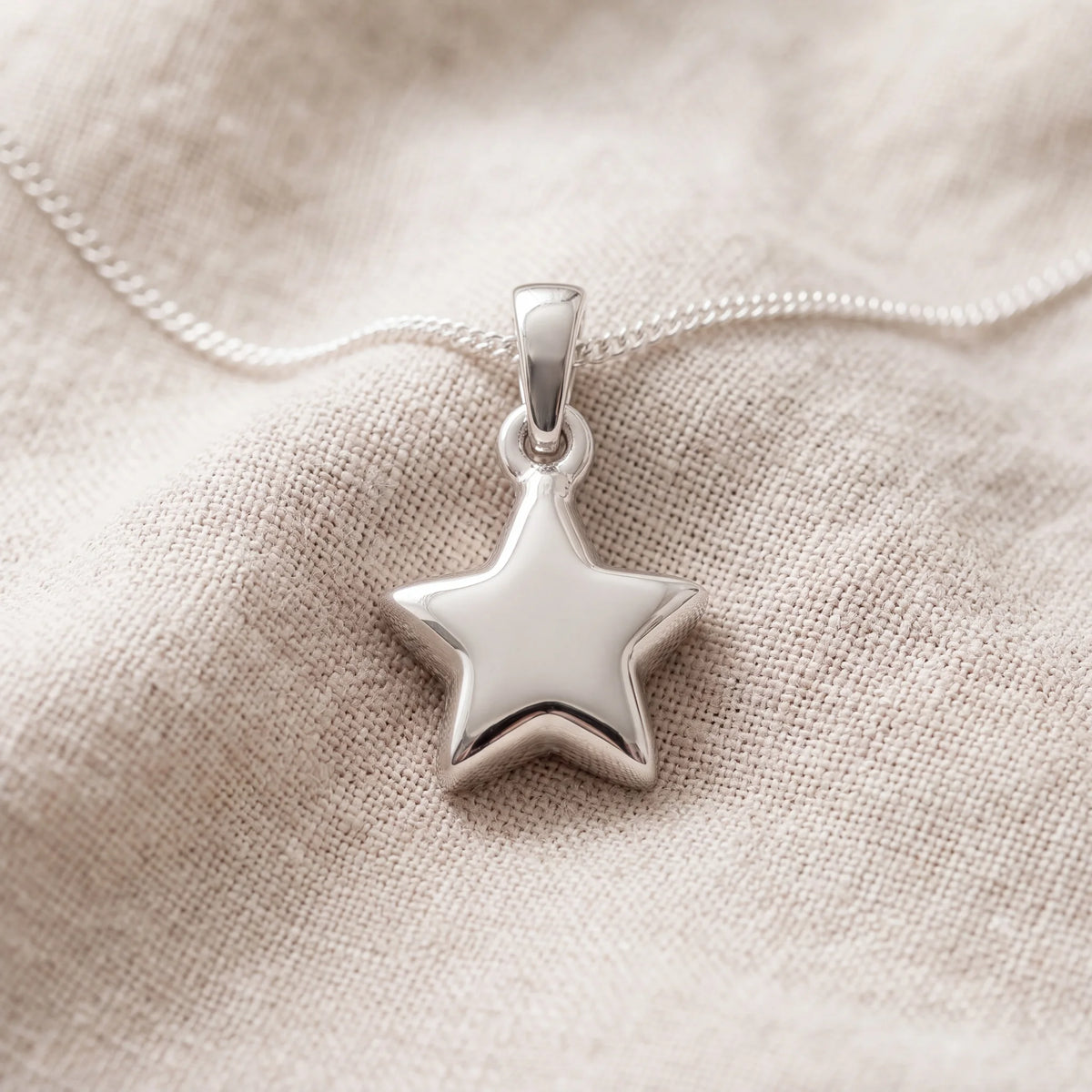 Self-fill-Classic-Star-Memorial-Ashes-Pendant-On-Linen