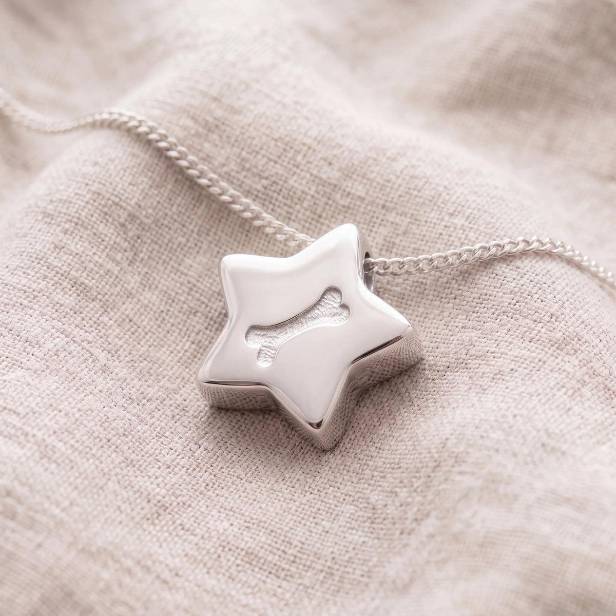 Self-fill-Dog-Bone-Star-Memorial-Ashes-Pendant-On-Linen