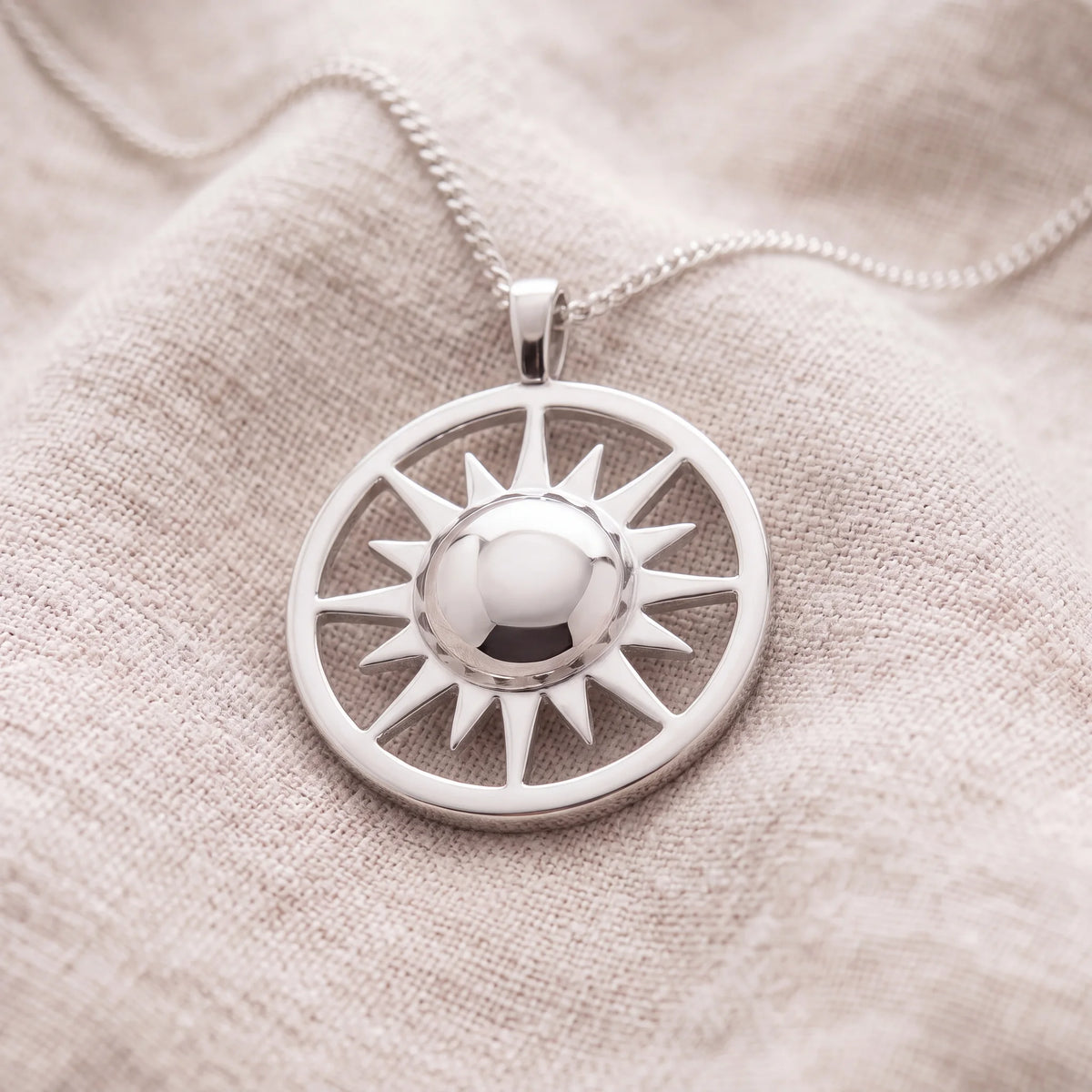 Self-fill-Eternal-Sun-Memorial-Ashes-Pendant-On-Linen