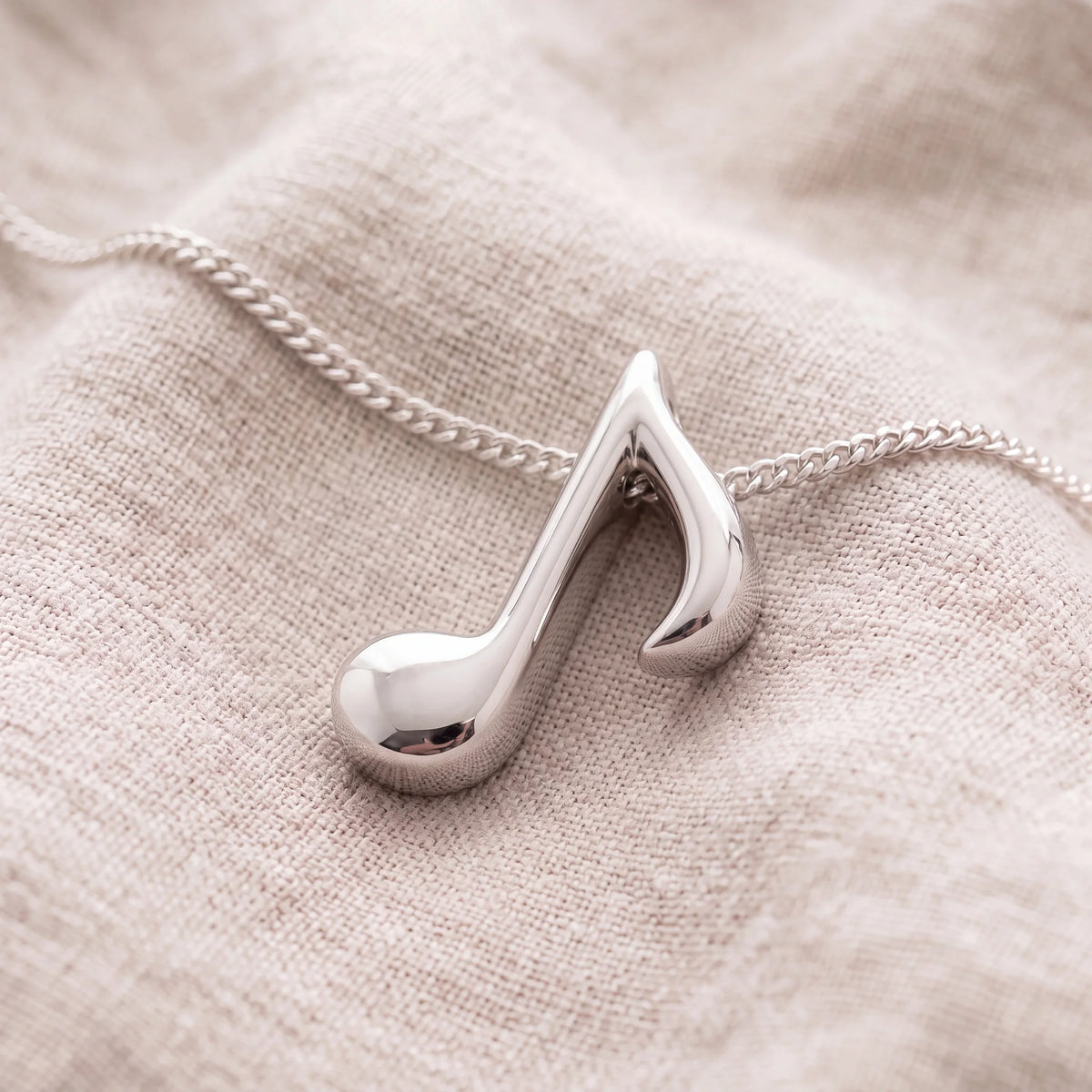 Self-fill-Musical-Eighth-Note-Memorial-Ashes-Pendant-On-Linen