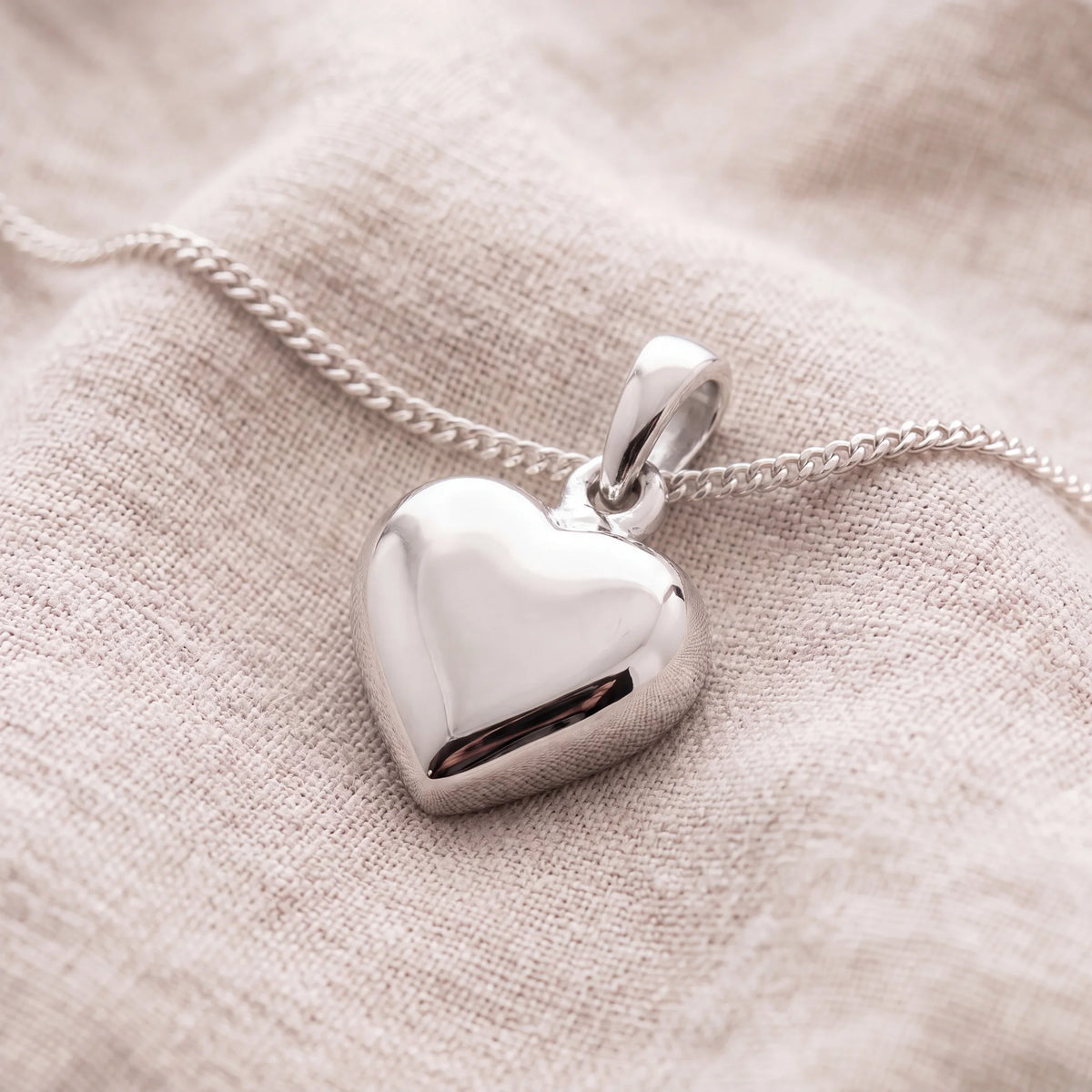 Self-fill-Petite-Heart-Memorial-Ashes-Pendant-On-Linen