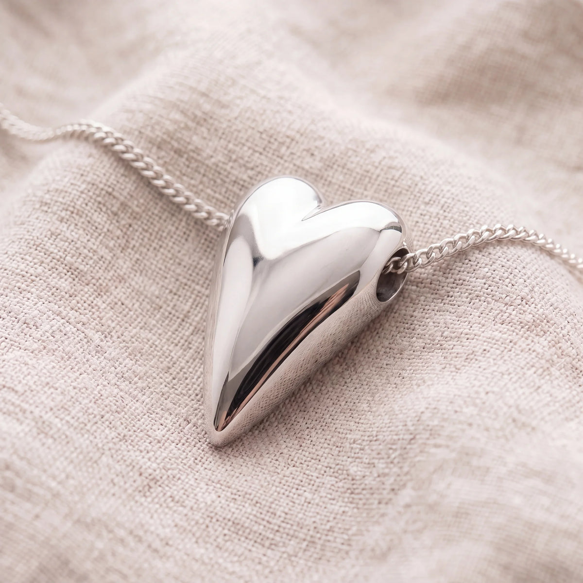 Self-fill-Tall-Heart-Memorial-Ashes-Pendant-On-Linen