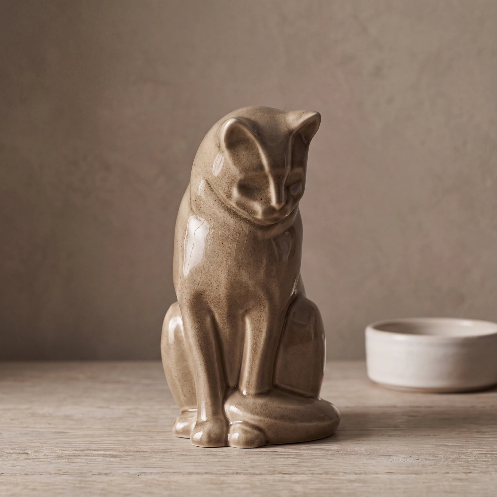 Sitting-Cat-Urn-for-Ashes-in-Beige-Grey-pet_bowl_ledge