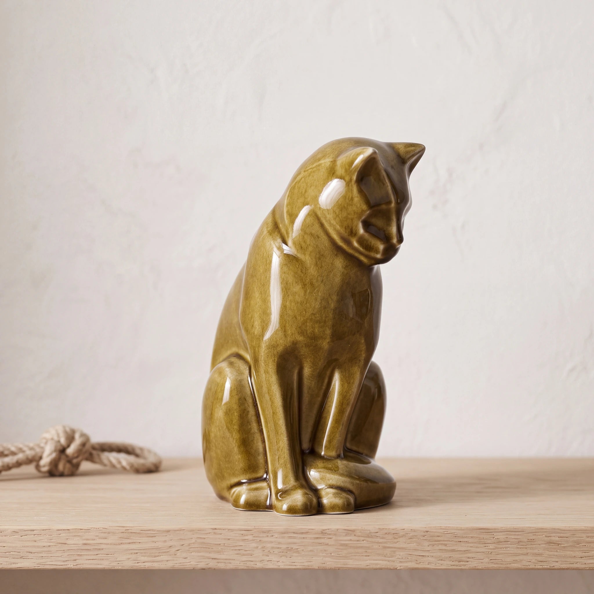 Sitting-Cat-Urn-for-Ashes-in-Dark-Sand-pet_soft_toy_shelf