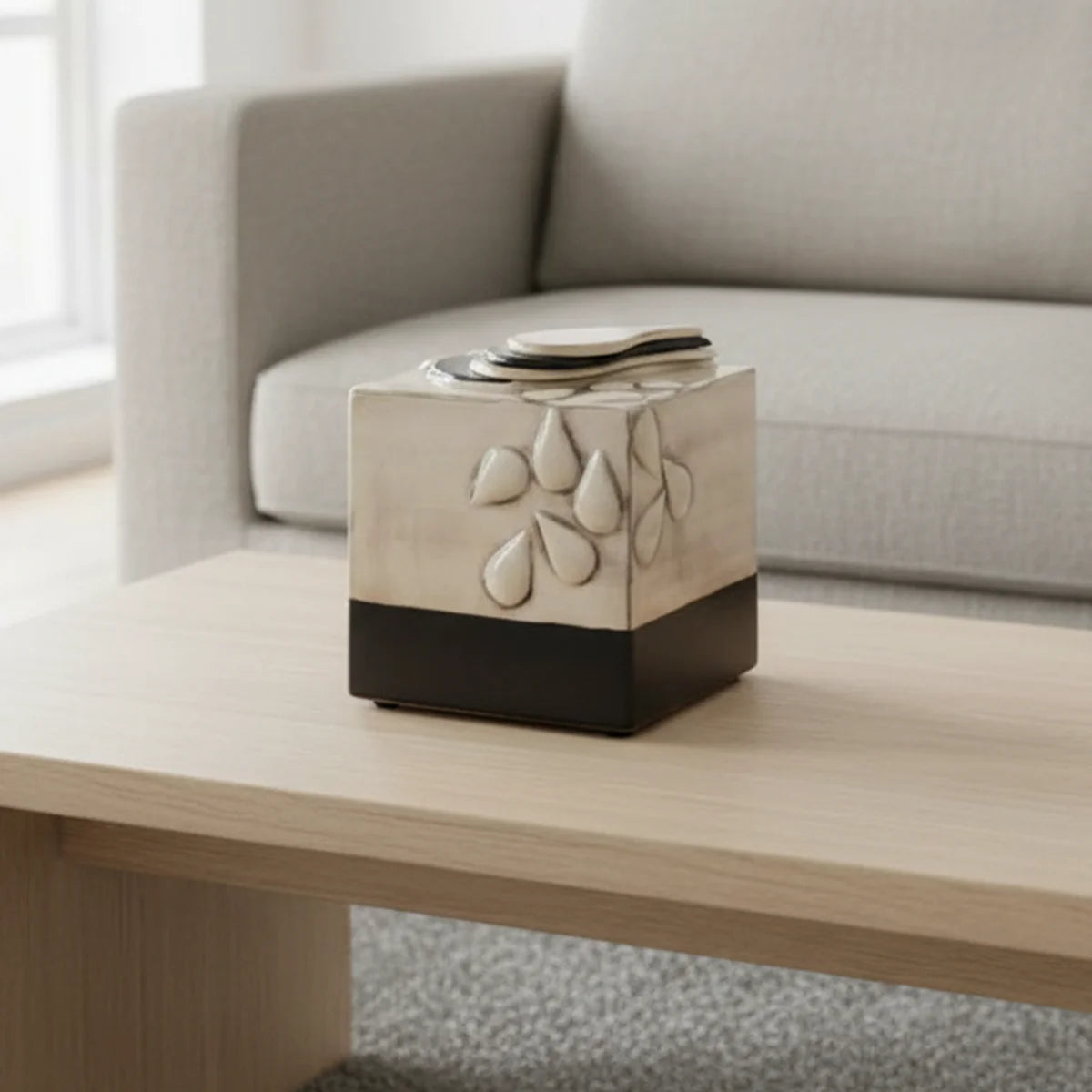 Teardrop Cube Adult Cremation Urn for Ashes on Coffee Table Close Up in Home