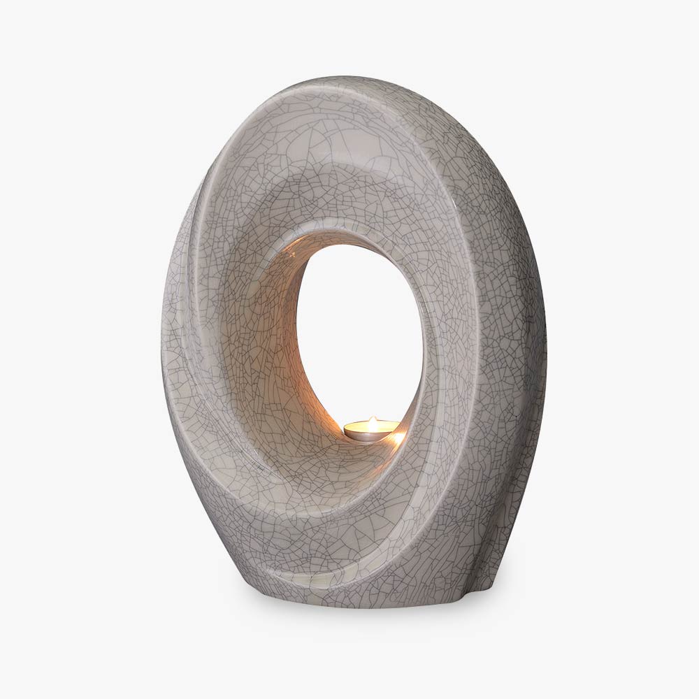 The Passage Adult Cremation Urn For Ashes in Crackle Glaze Front Left View Studio Background