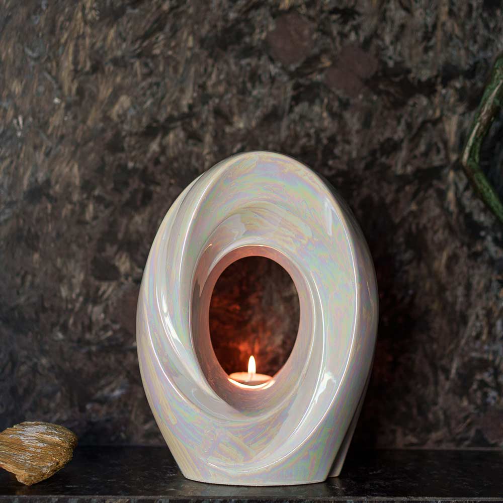 The Passage Adult Cremation Urn for Ashes in Pearlescent White on Shelf Front