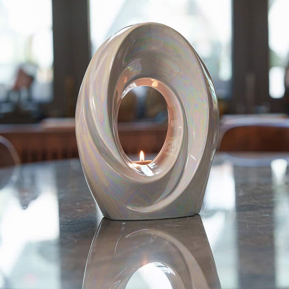 The Passage Adult Cremation Urn for Ashes in Pearlescent White on Table Right