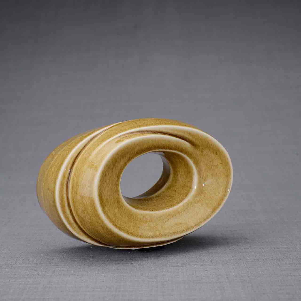 The Passage Ashes Keepsake Urn in Dark Sand Turned Right Dark Background