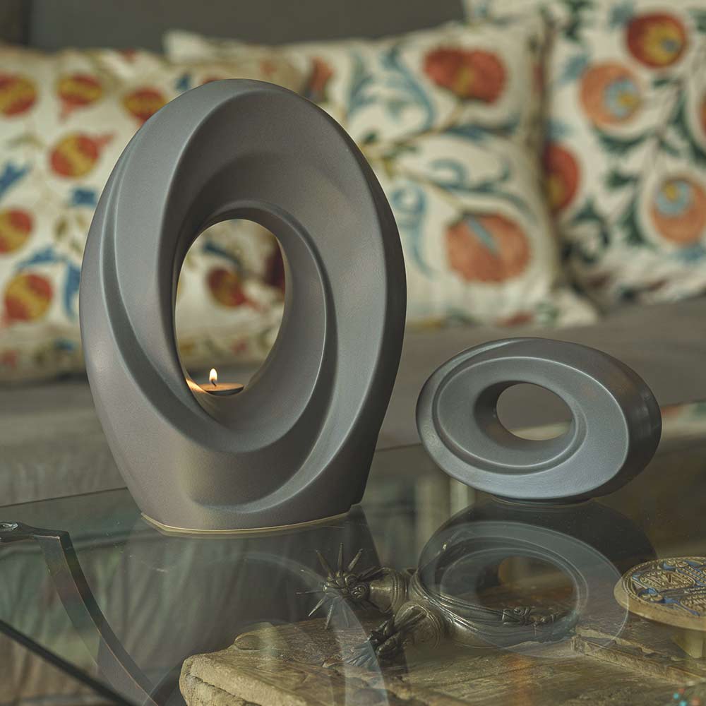 The Passage Cremation Urn for Ashes Matte Grey with Ashes Keepsake Inside on Table