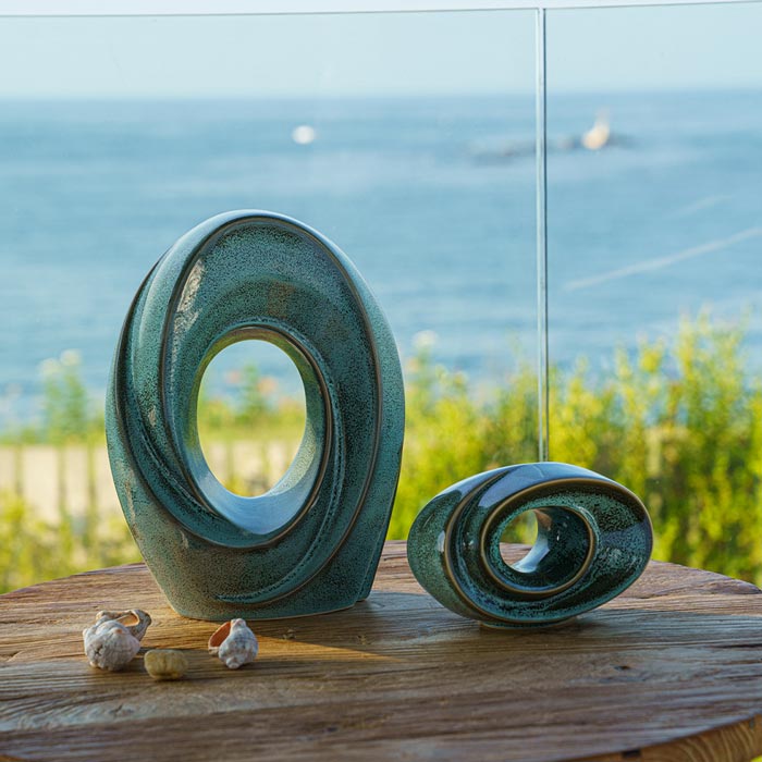 The Passage Cremation Urn for Ashes Oily Green on Table Near Window