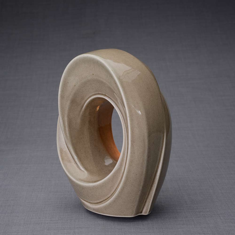 The Passage Cremation Urn for Ashes in Beige Grey Facing Left Dark Background