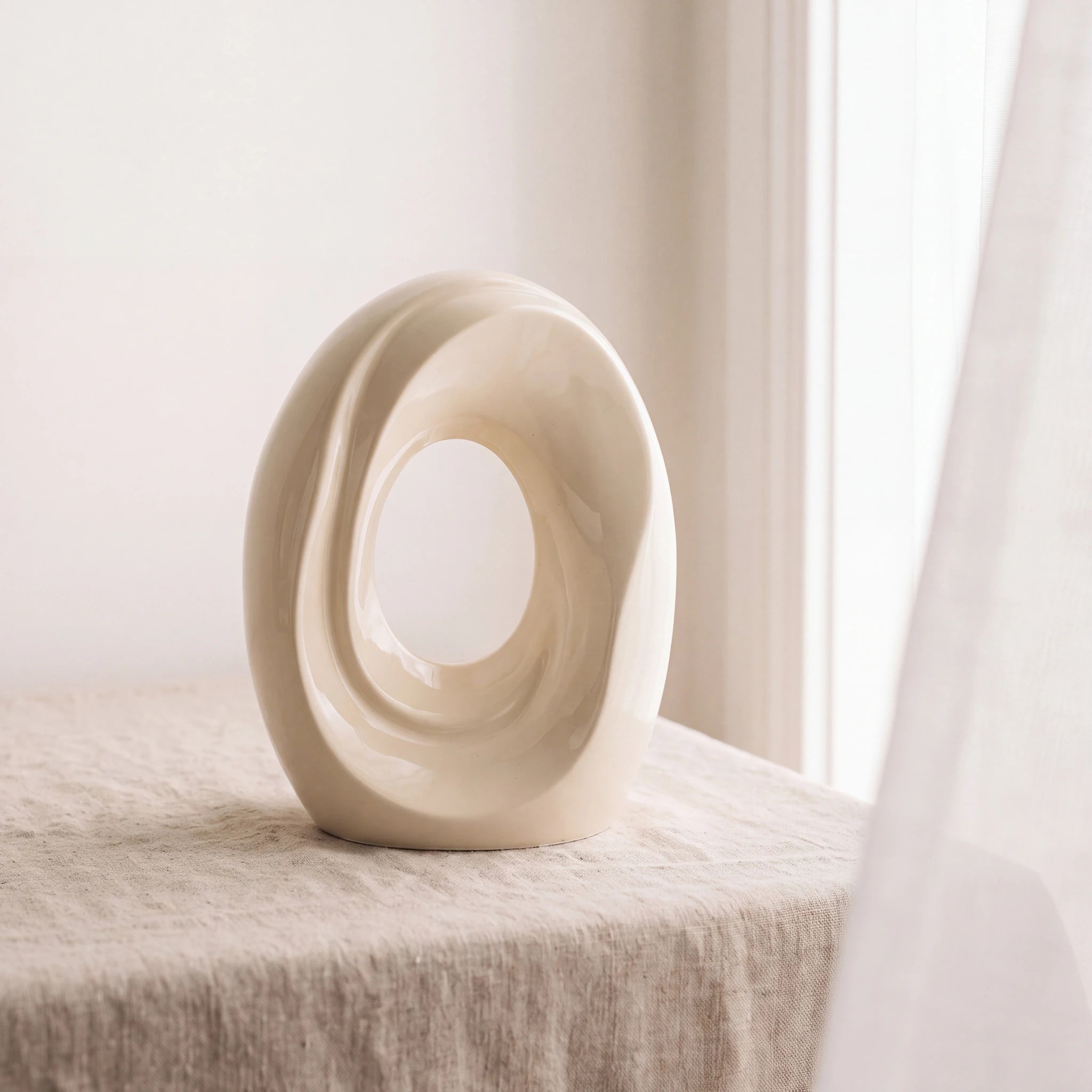 The-Passage-Medium-Urn-for-Ashes-in-Cream-Linen-Table