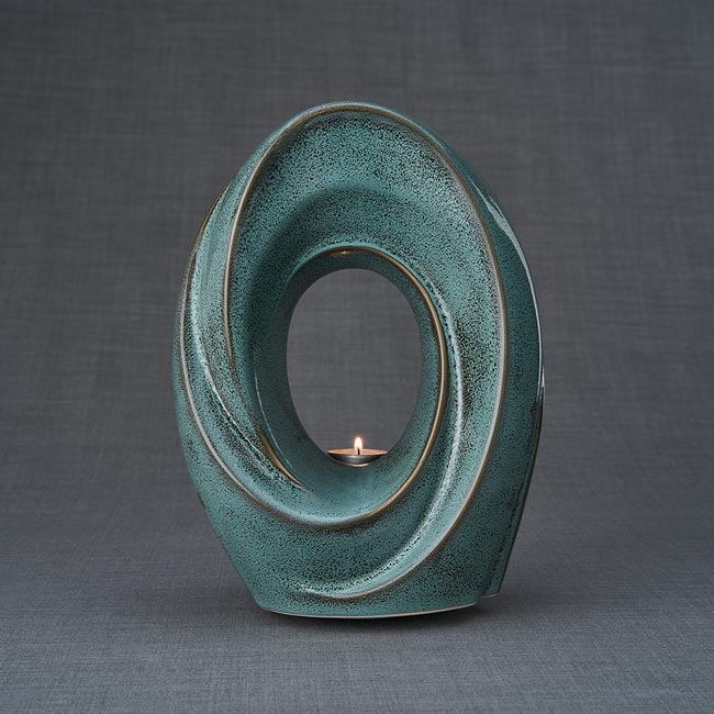 The Passage Urn for Ashes in Oily Green Front View Dark Background