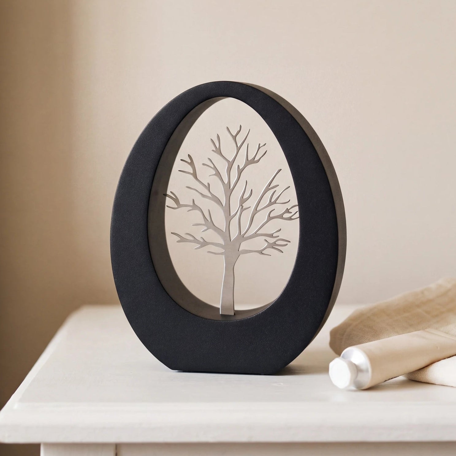 Tree-of-Life-Small-Urn-for-Ashes-in-Matte-Black-Stainless-Steel-keepsake_handcream