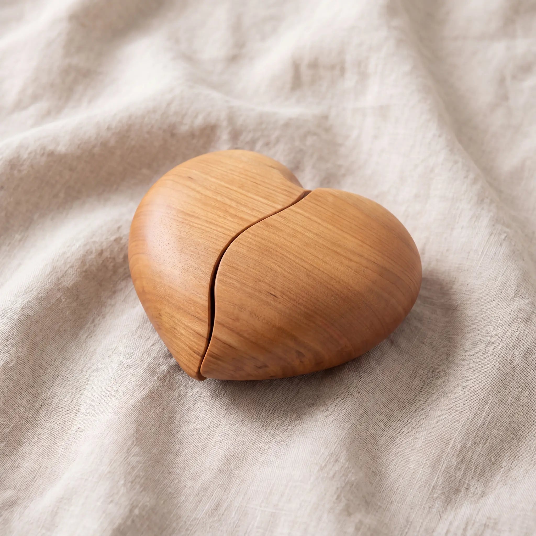 Unity-Cherry-Wood-Heart-Keepsake-Urn-for-Ashes-On-Linen