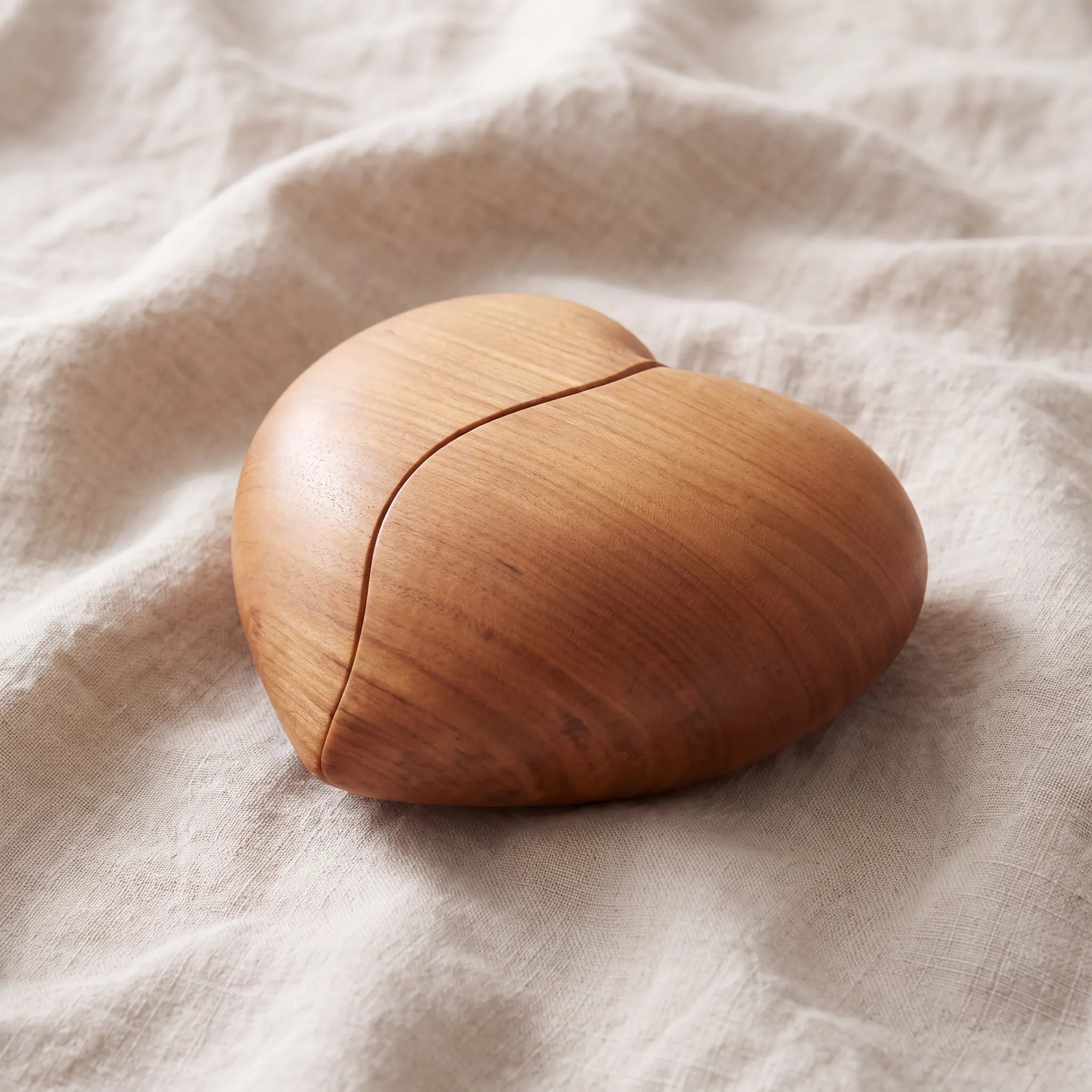 Unity-Heart-Duo-Wooden-Keepsake-Urn-for-Ashes-in-Cherry-On-Linen