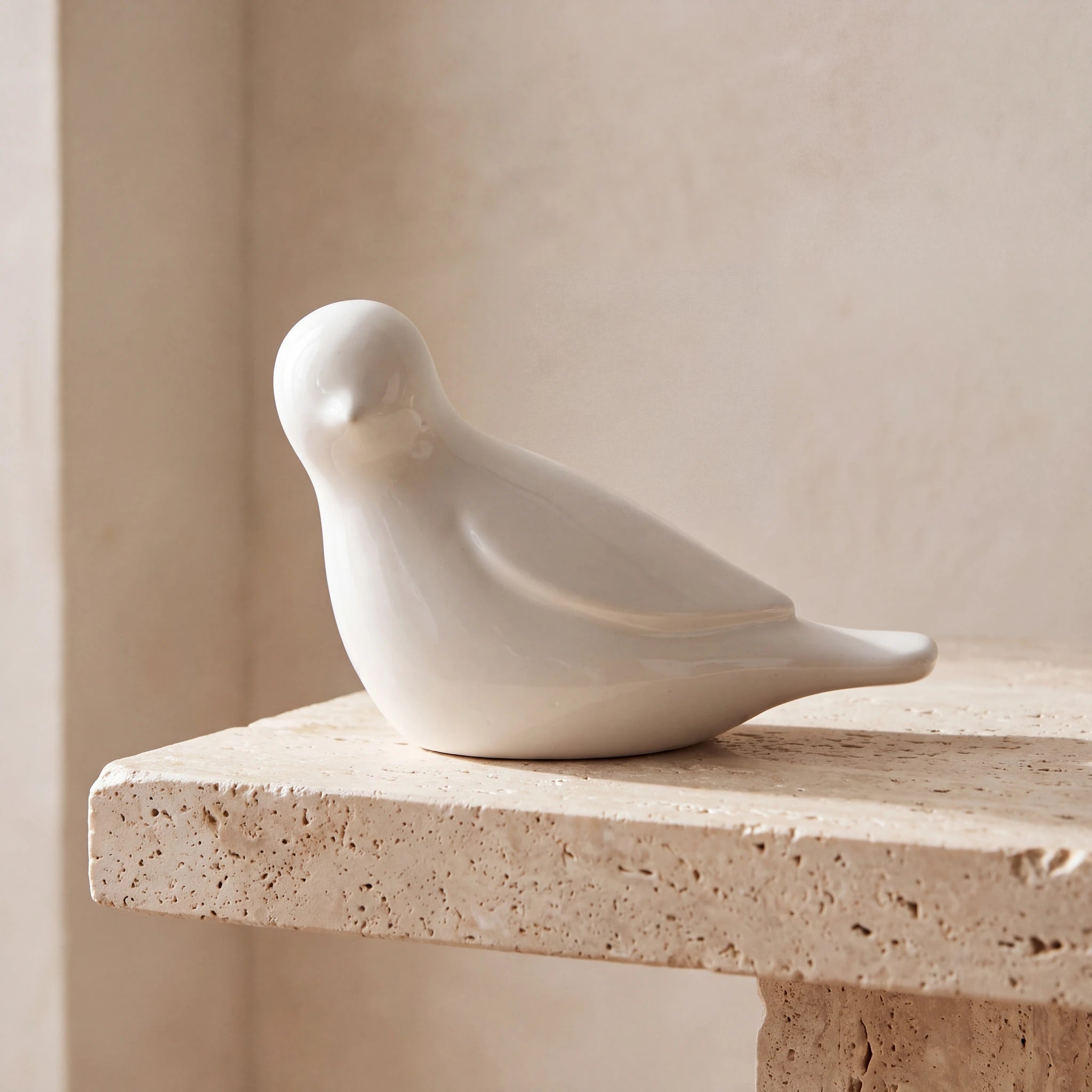 Whistling-Bird-Keepsake-Urn-for-Ashes-in-Sage-White-Travertine-Ledge