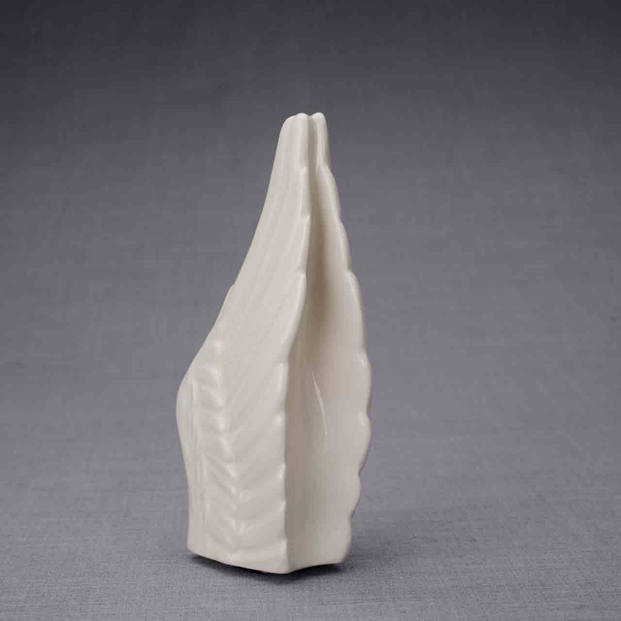 Wings Ashes Keepsake Urn in Cream Dark Background