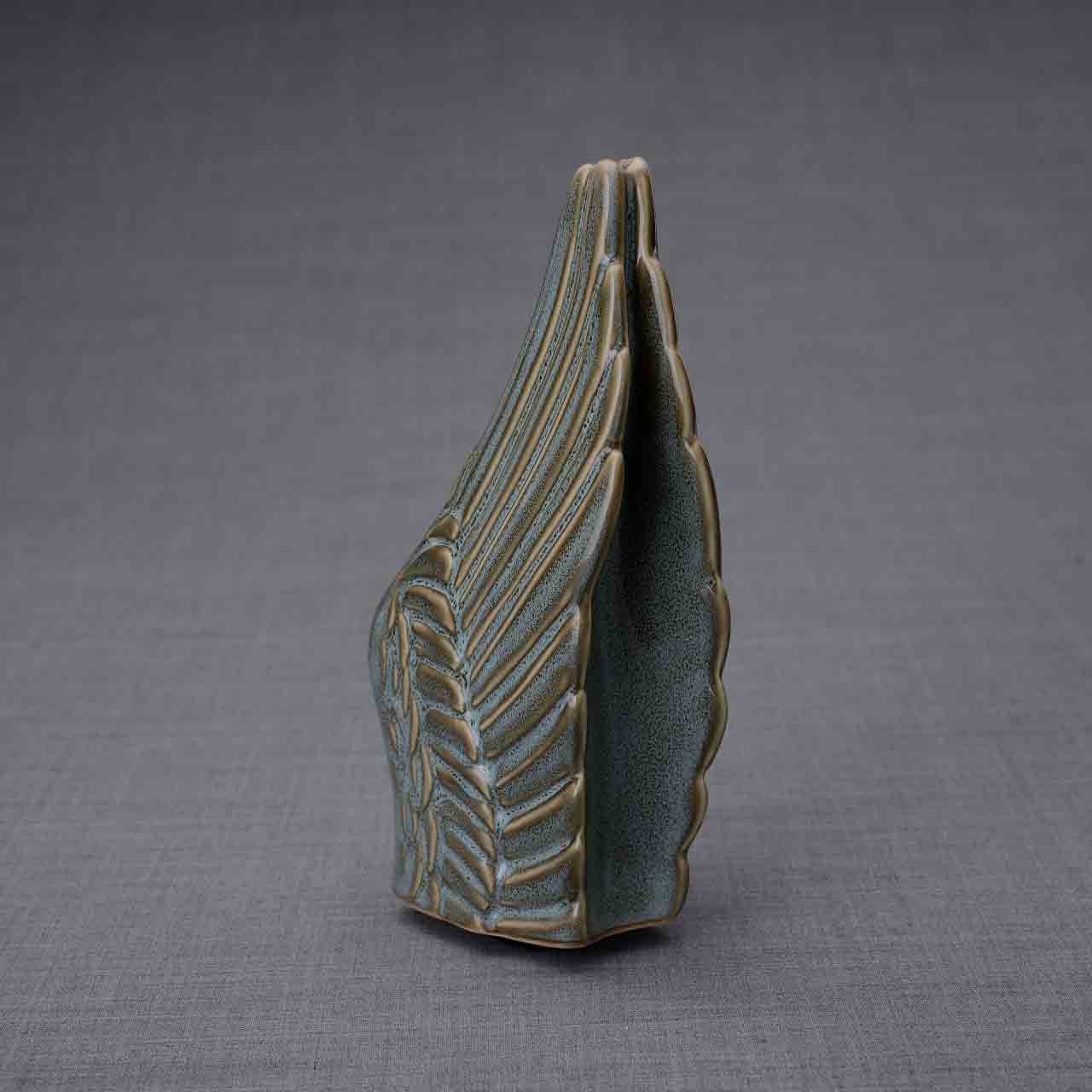 Wings Ashes Keepsake Urn in Oily Green Dark Background