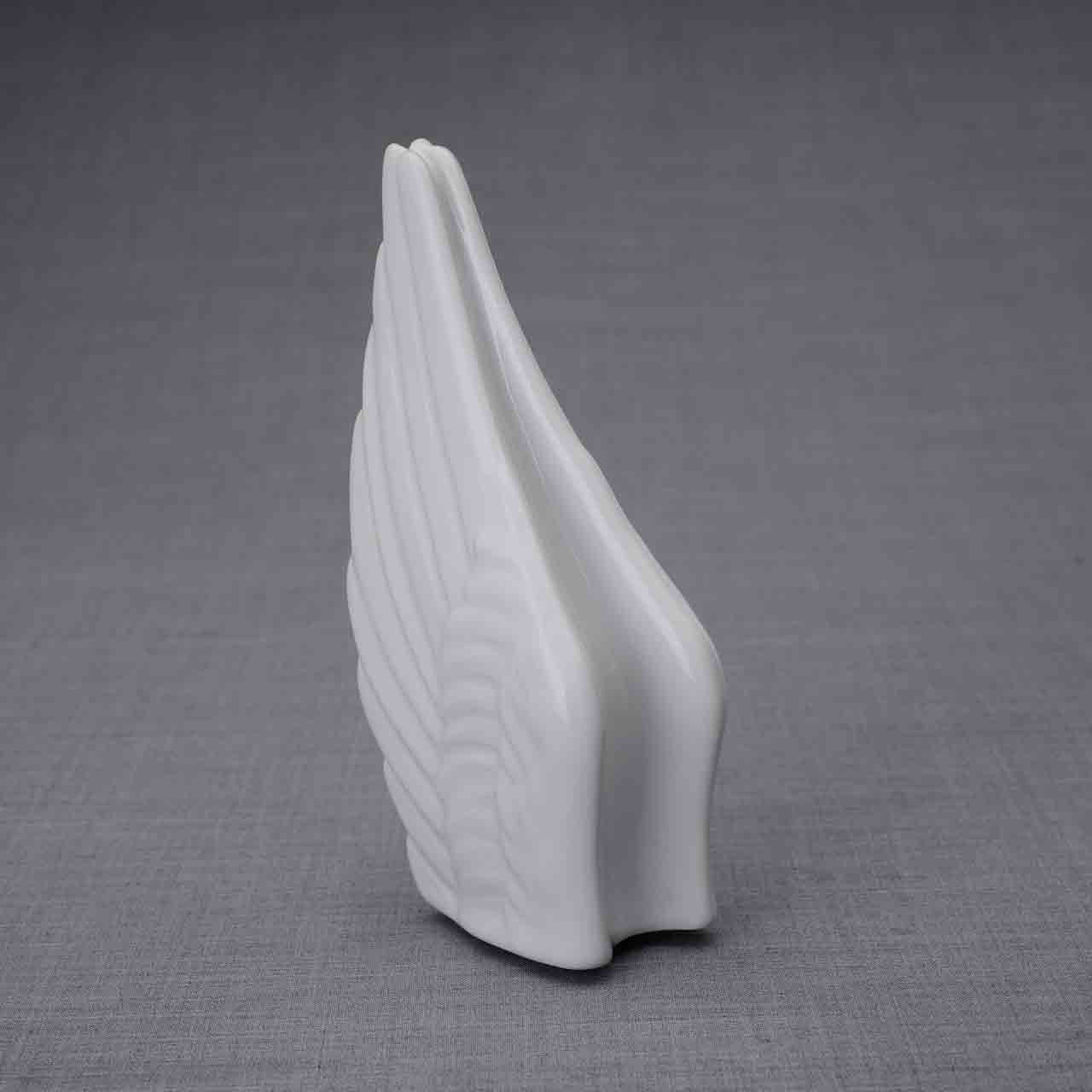 Wings Ashes Keepsake Urn in White Turned Left Dark Background
