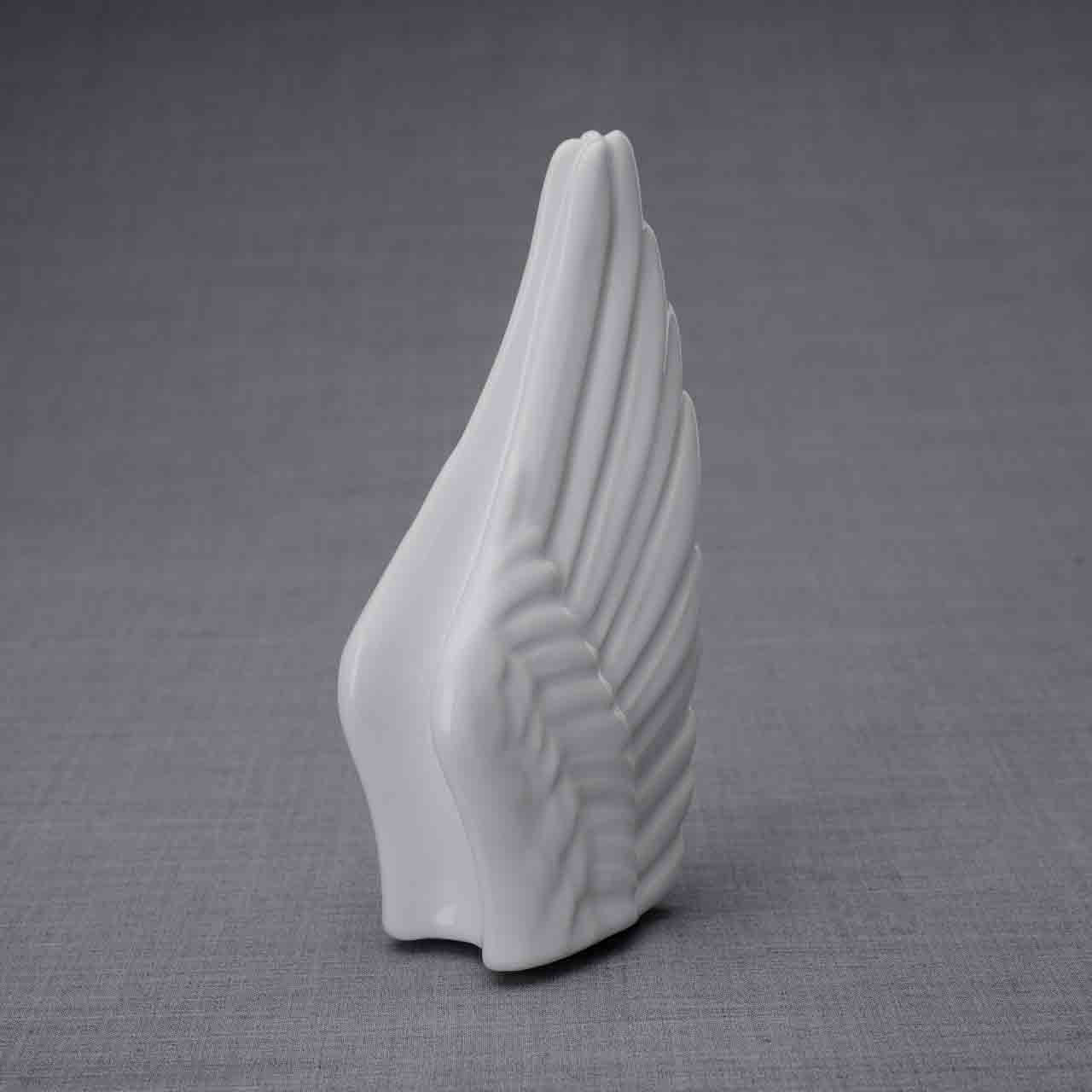 Wings Ashes Keepsake Urn in White Turned Right Dark Background