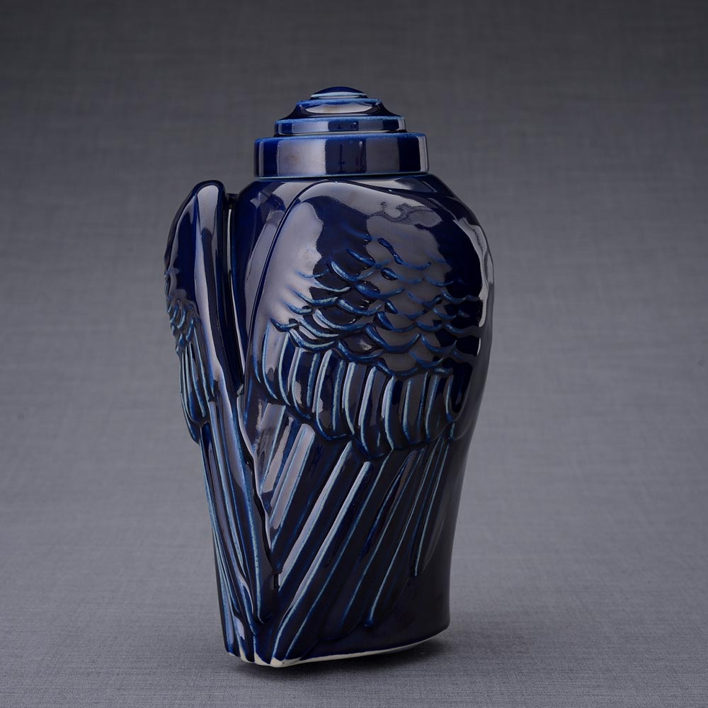 Wings Cremation Urn for Ashes in Metallic Blue Turned Left Dark Background
