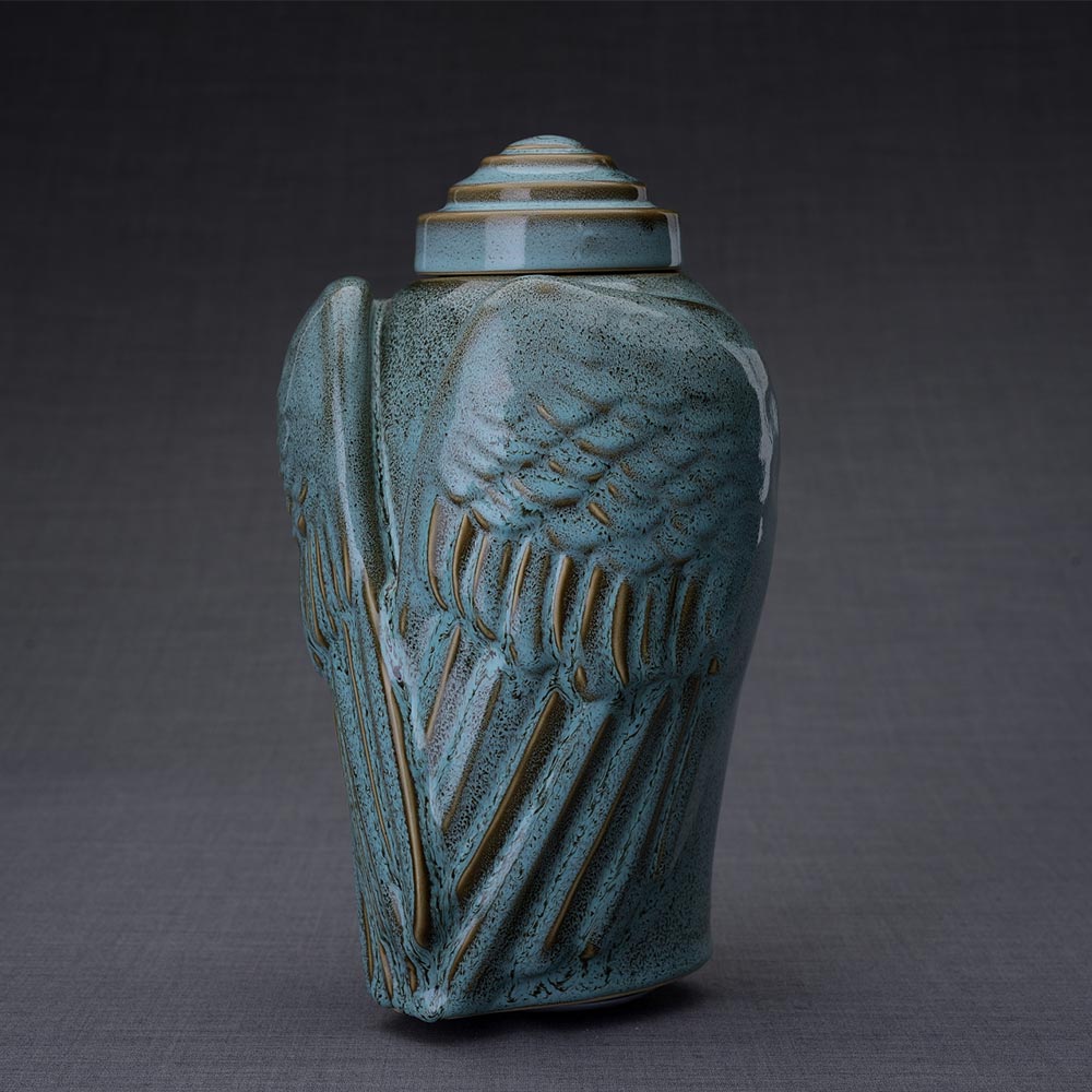 Wings Cremation Urn for Ashes in Oily Green Turned Left Dark Background