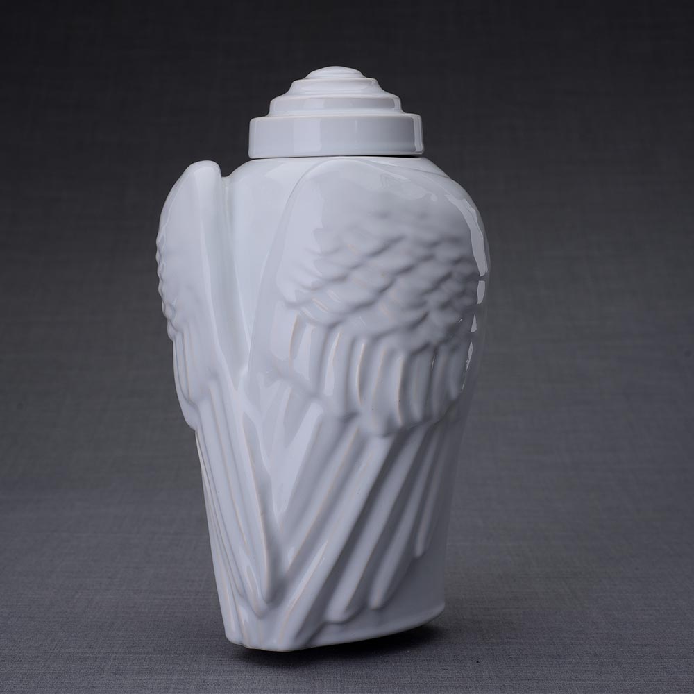 Wings Cremation Urn for Ashes in White Turned Left Dark Background
