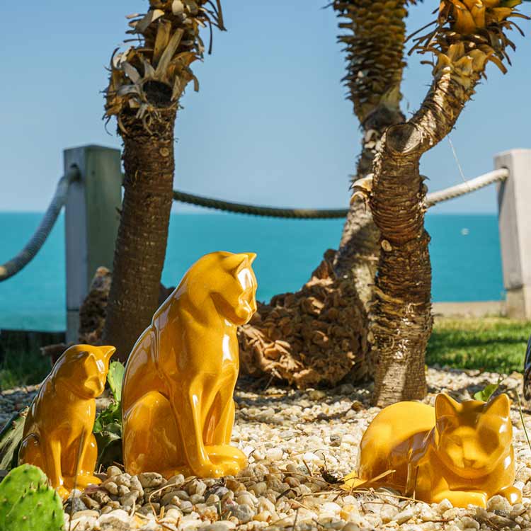 amber cat urns for ashes outside in sun sunshine