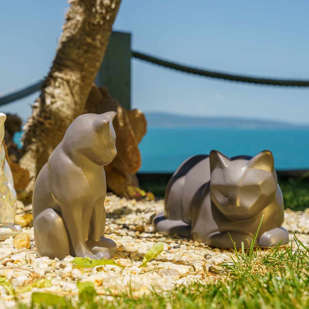matte grey cat urns for ashes outside in the sunlight