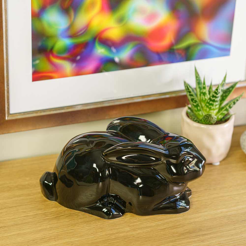Rabbit Urn For Ashes Glossy Black On Shelf Right