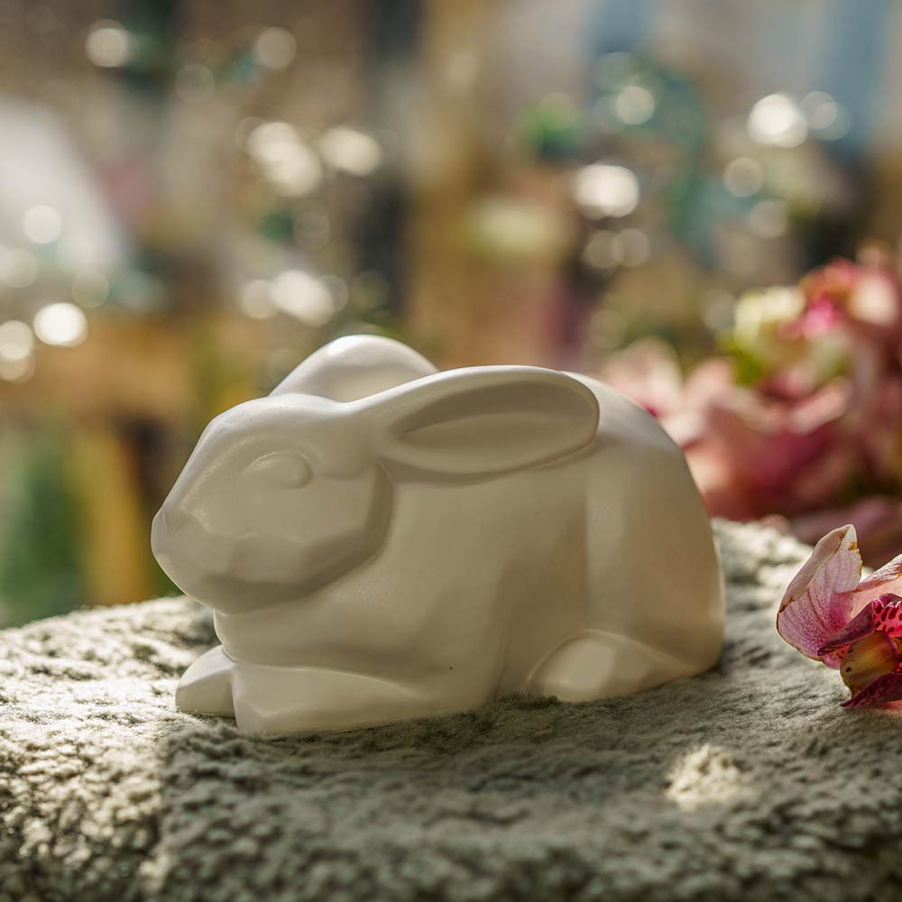 Rabbit Urn For Ashes Matte White On Cushion Front Left