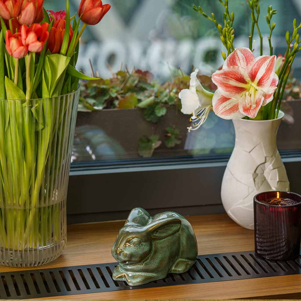 Rabbit Urn For Ashes Oily Green By Window Front Left With Flowers
