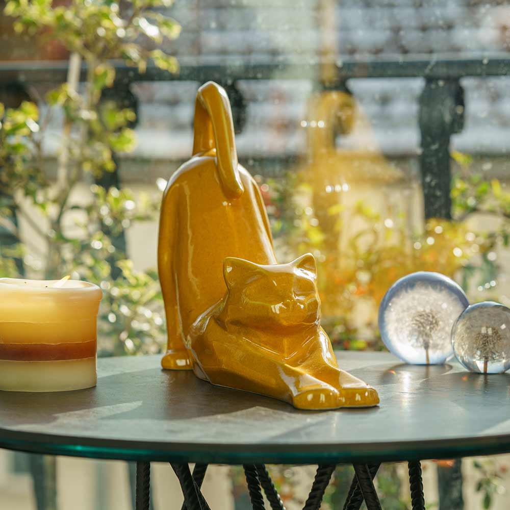Stretching Cat Urn For Ashes Amber On Table Front Right