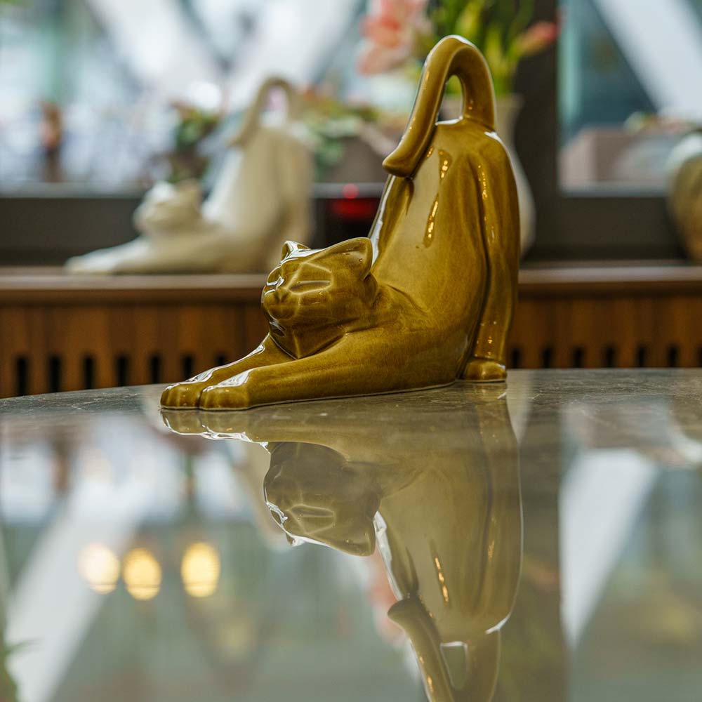 Stretching Cat Urn For Ashes Dark Sand On Table Front Left Zoomed Out