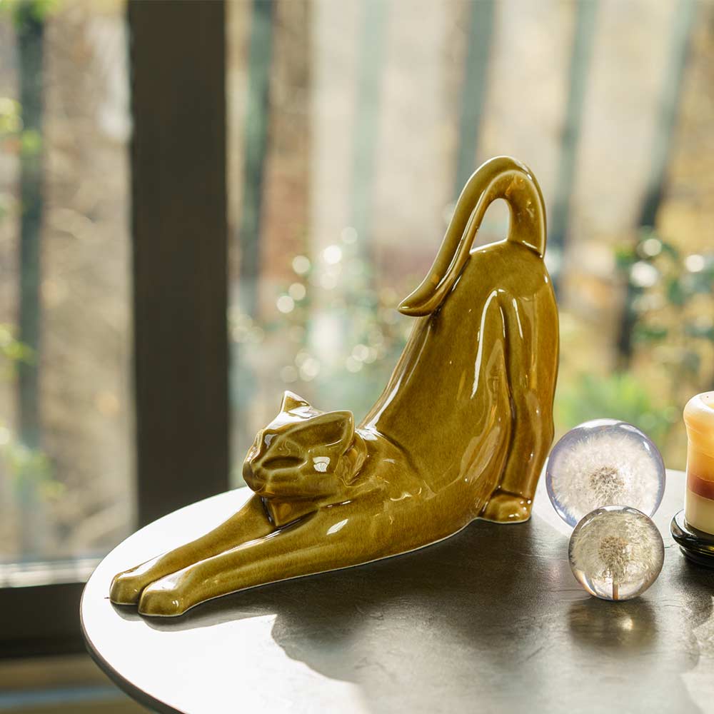 Stretching Cat Urn For Ashes Dark Sand On Table Front Left