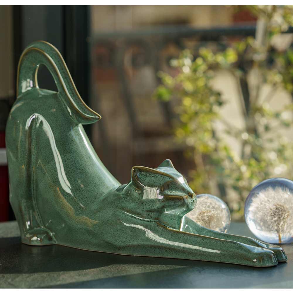 Stretching Cat Urn For Ashes Oily Green On Window Ledge Front Right