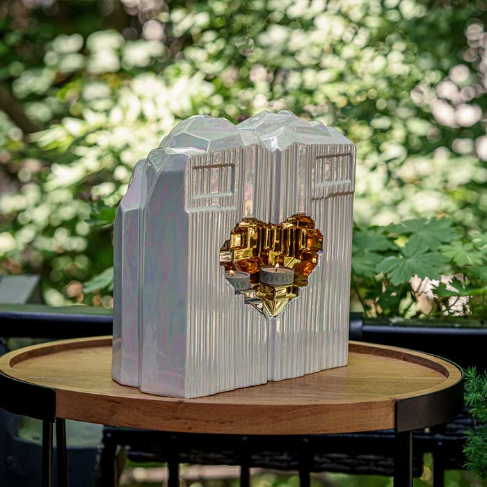 Heart Cremation Urn for Ashes Pearlescent White and Gold with Companion Outside on Table