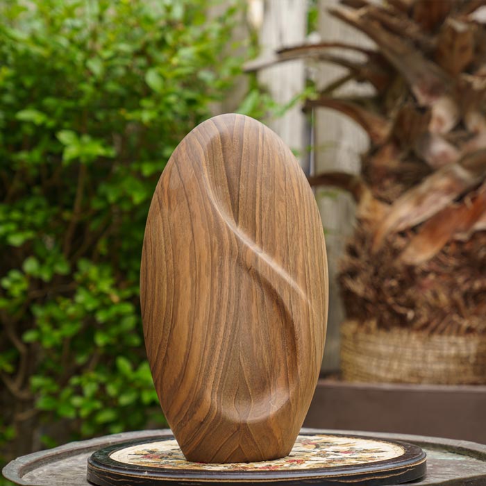 Infinity Wooden Adult Urn for Ashes Walnut Wood on Table in Garden