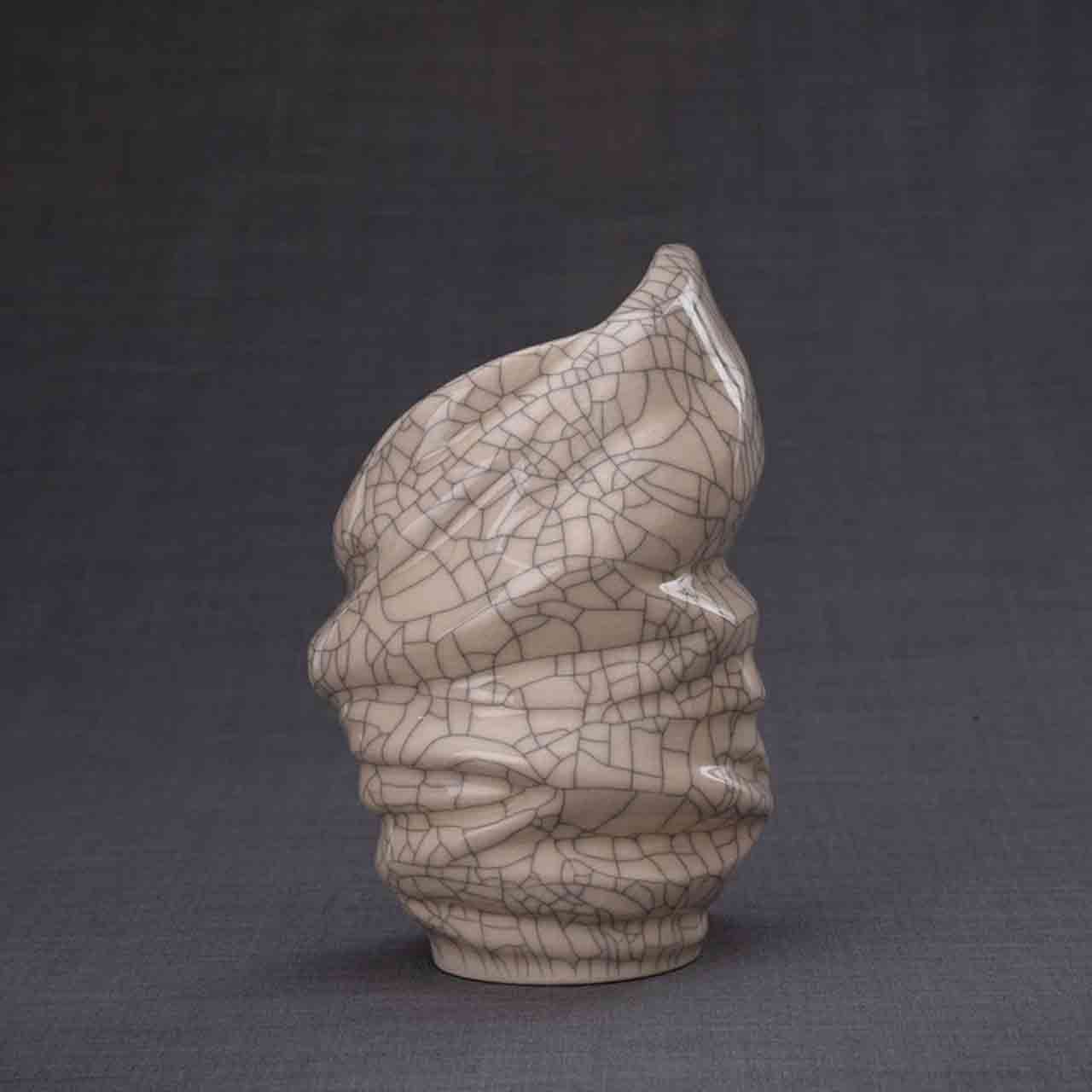 Light Ashes Keepsake Urn in Crackle Glaze Dark Background Behind
