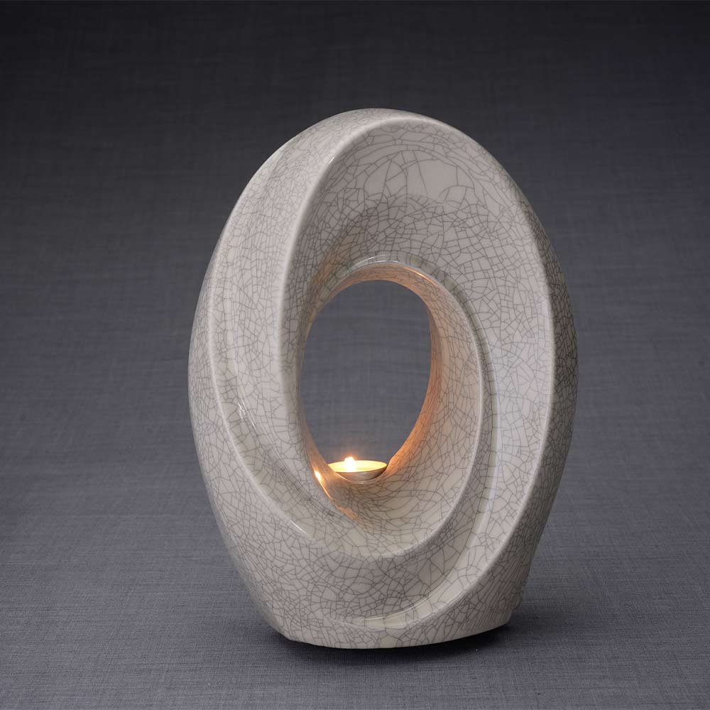 The Passage Cremation Urn for Ashes in Crackle Glaze Turned Right Dark Background
