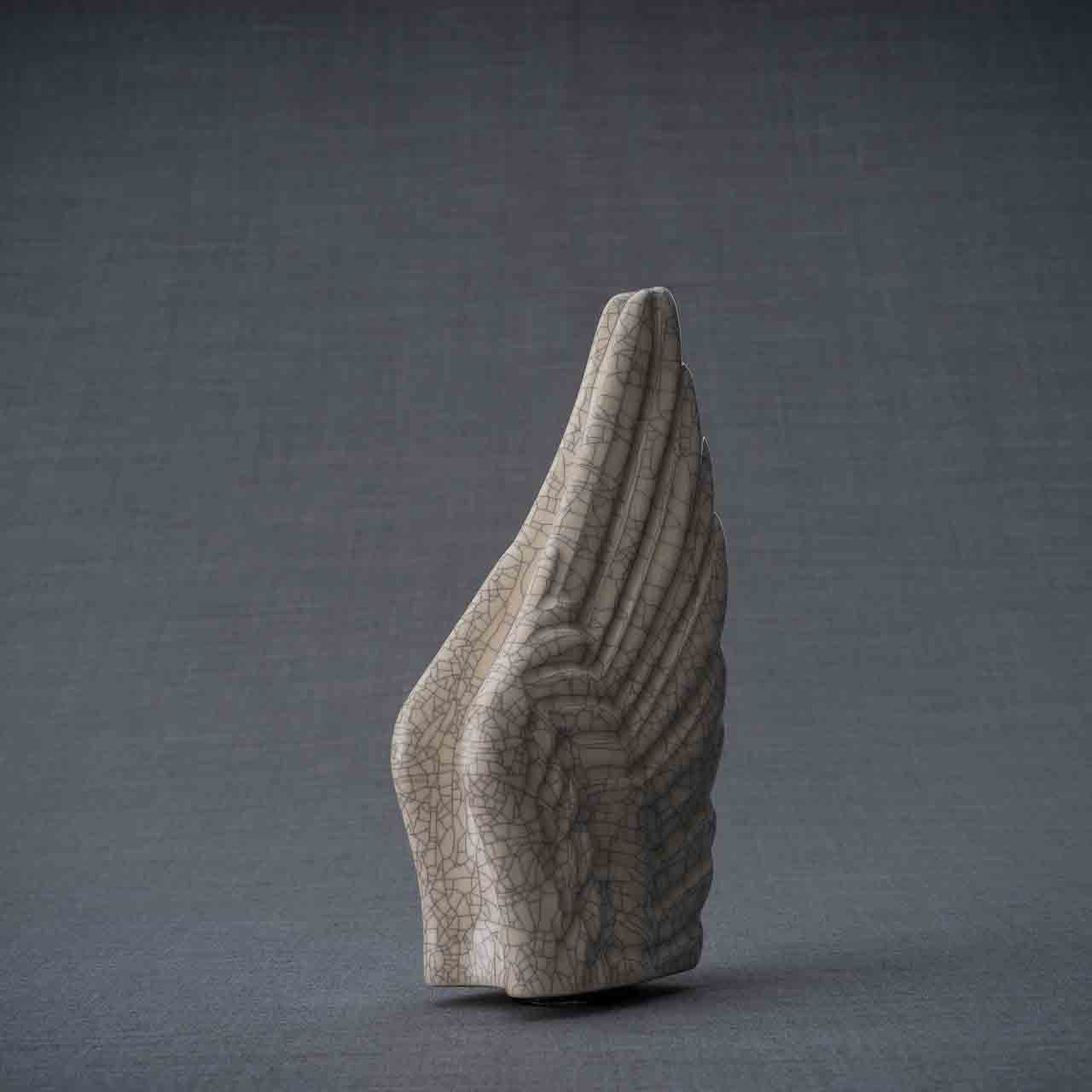 Angel Wings Ashes Keepsake Urn in Crackle Glaze Turned Right Dark Background