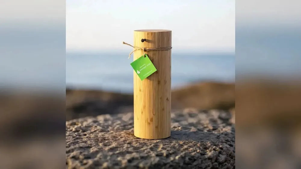 Eco Bamboo biodegradable scattering tube urn placed outdoors